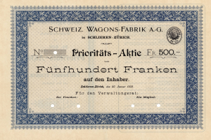 Ein altes deutsches Aktienzertifikat mit blauem Rand, das den Text "Schweiz Wagons-Fabrik A.G." trägt